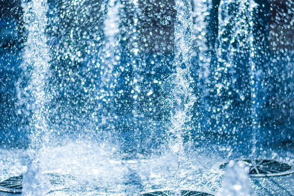 The gush of water of a fountain. Splash of water in the fountain, abstract image