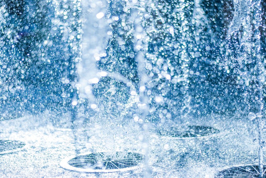 The gush of water of a fountain. Splash of water in the fountain, abstract image