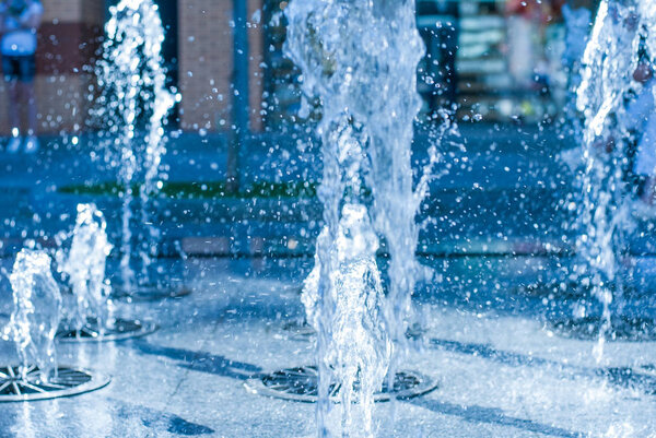 The gush of water of a fountain. Splash of water in the fountain, abstract image