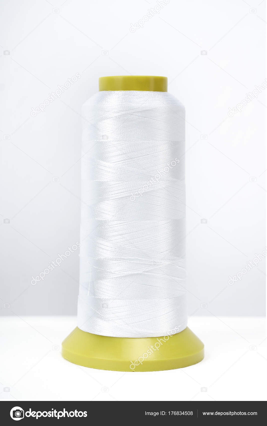 Spool of thread isolated on white background Stock Photo by ©Simikov