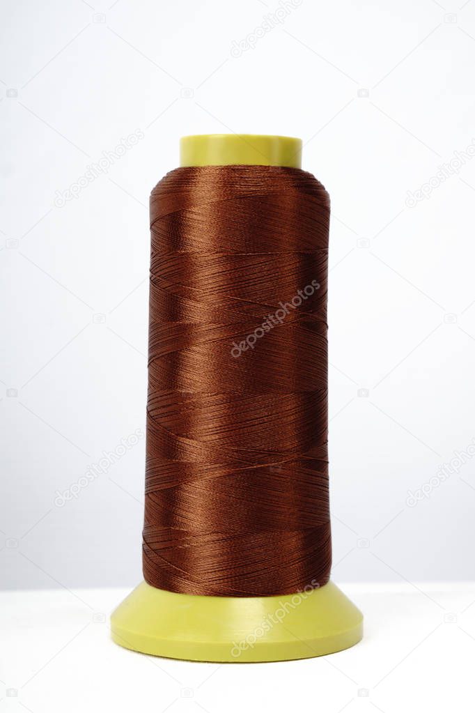 Spool of thread isolated on white background