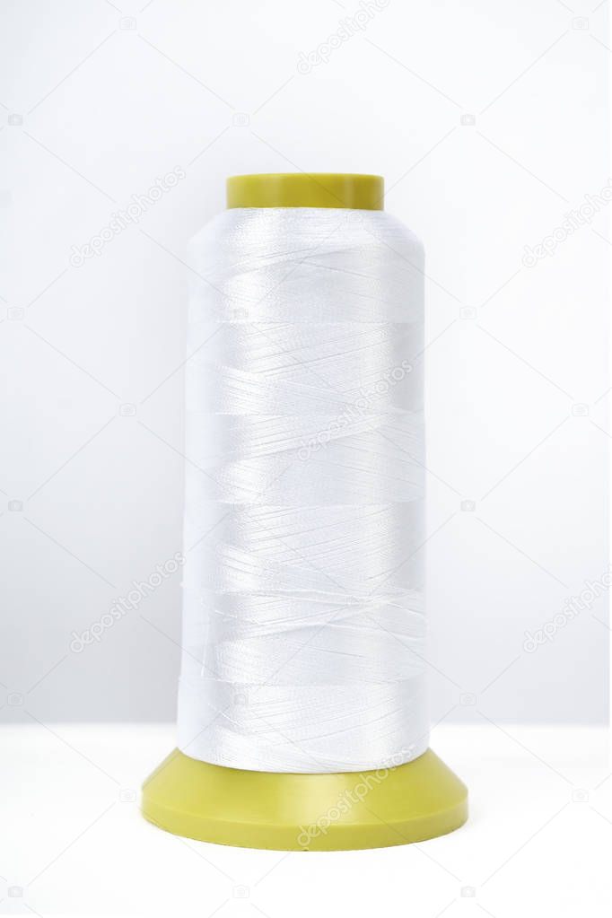 Spool of thread isolated on white background