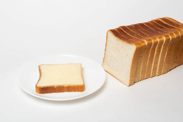 Plátek Pšeničného Chleba Namazaný Máslem — Stock fotografie