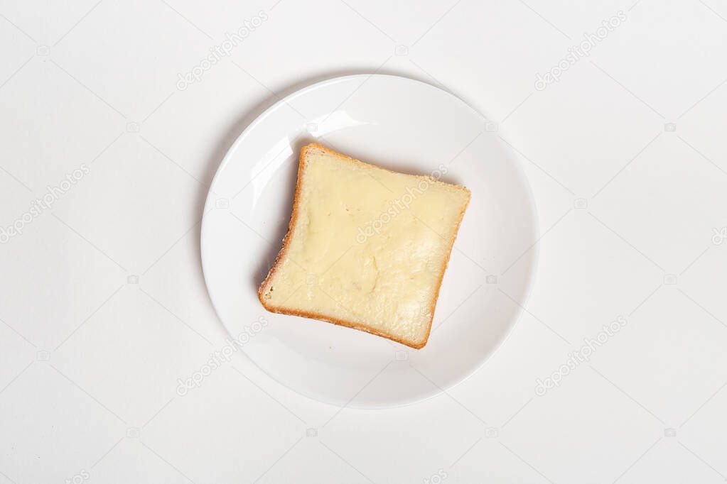 slice of wheaten bread spreaded with butter