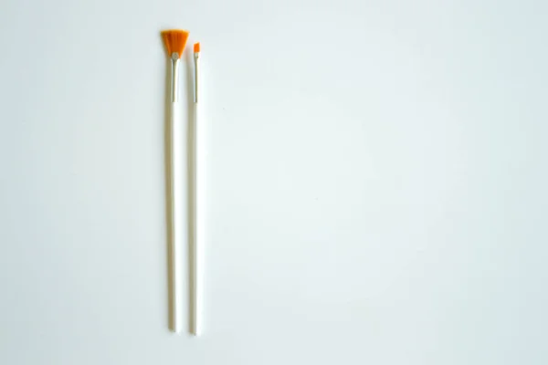 Paint artistic brushes on a white background — Stock Photo, Image
