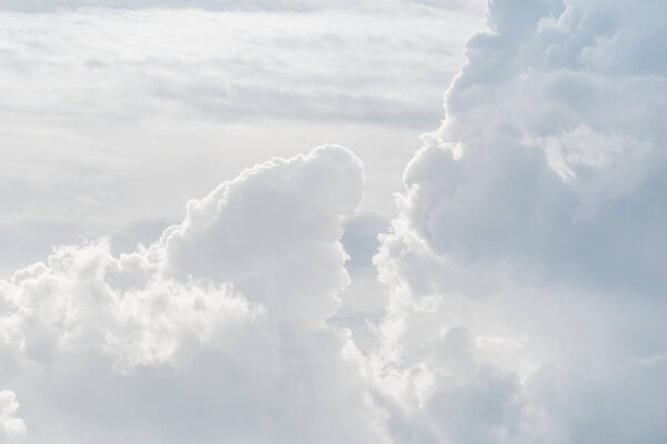 White sky and puffy cloud.