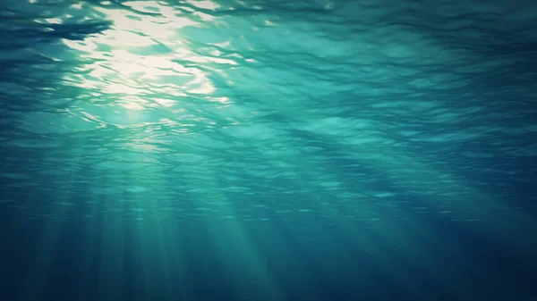 Die Sonnenstrahlen bahnen sich ihren Weg durch die Wasseroberfläche in die Tiefe. Unterwasserhintergrund. — Stockfoto