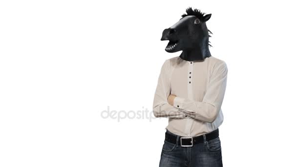 Man in a horse mask nods his head dancing isolated on a white background — Stock Video