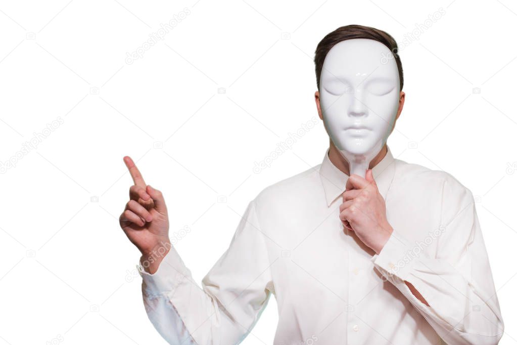 Young man isolated on white background in white mask. Place for your text or image