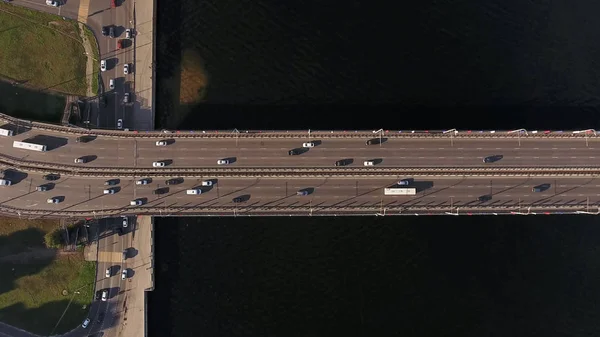 Aerial water power plant view with crossroads and roads, houses, buildings, parks and parking lots, bridges. Copter shot. Panoramic image.