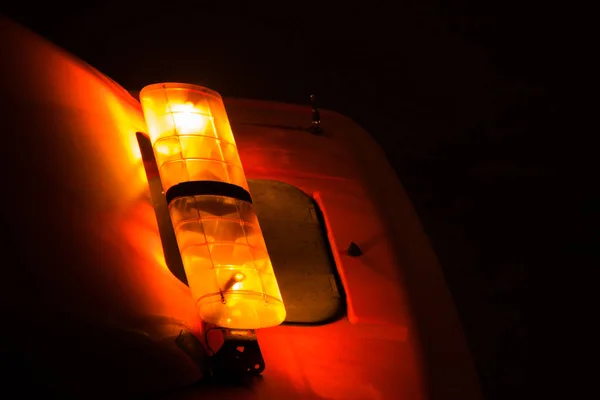 Emergency light or Flashing beacon. Orange flashing and revolving light on top of a support and services vehicle. — Stock Photo, Image