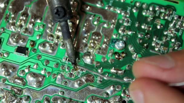 Technical soldering of chips using a soldering iron — Stock Video
