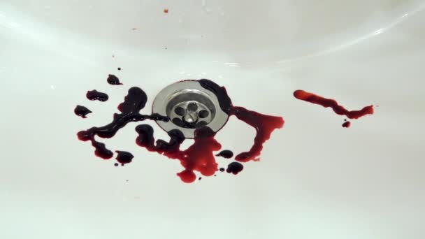Splashes of blood dripping into the sink in the bathroom — Stock Video