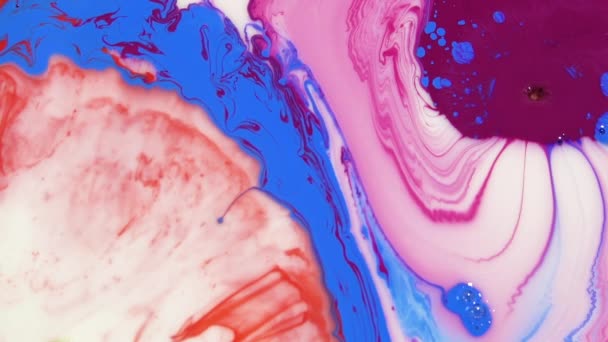 Bright colorful acrylic paints mix into abstract pigments in slow motion. Abstract color moving background close up macro — 비디오