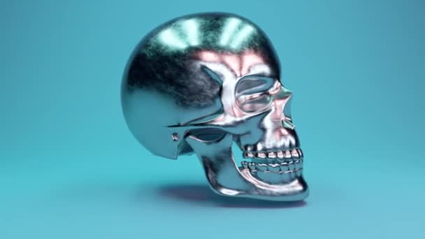 Un crâne humain en métal rayé tourne à 360 degrés sur un fond bleu glamour. Boucle sans couture rendu 3d 