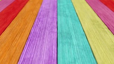Old wood plank rainbow background with depth of field. Seamless loop 3d render