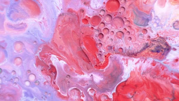 Colorful sparkling paints mix in beautiful patterns. Oil ink of blue and other colors spread on the surface and mix one into another creating amazing textures and design. — Stock Video