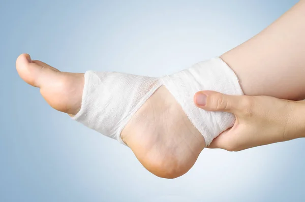 Injured foot with bandage — Stock Photo, Image