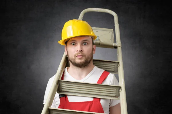 Clumsy worker with ladder — Stock Photo, Image