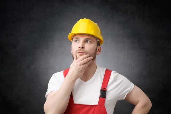 Thoughtful construction worker — Stock Photo, Image