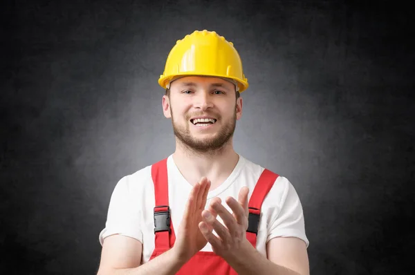 Construction worker clapping his hands — Stock Photo, Image