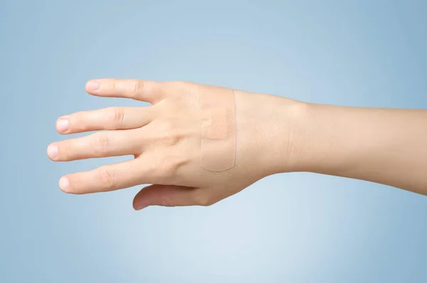 Plaster on female hand — Stock Photo, Image