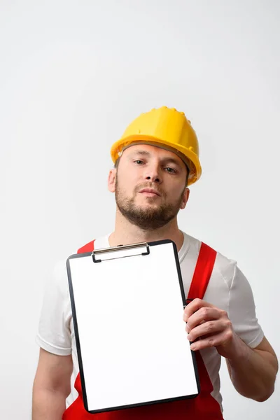 Worker holding blank clipboard on white background — Stock Photo, Image