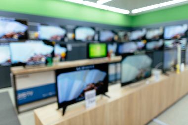 Plazma Tv elektronik mağaza bölümü. Televizyon perakende satmak stok. Bulanık fotoğraf