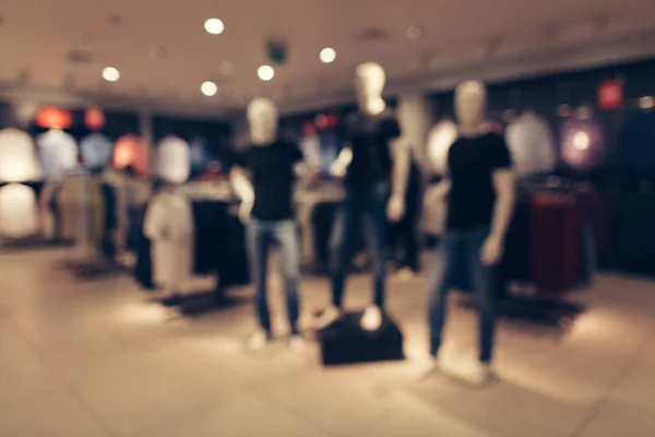 Men\'s clothing store. Blurred image of mannequins in men\'s fashion store. Abstract blurred of shopping mall boutique interio