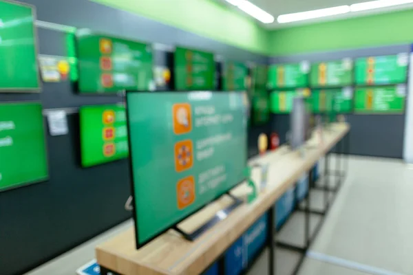 Plasma TV in electronics store. Department of plasma TV with bokeh blurred background