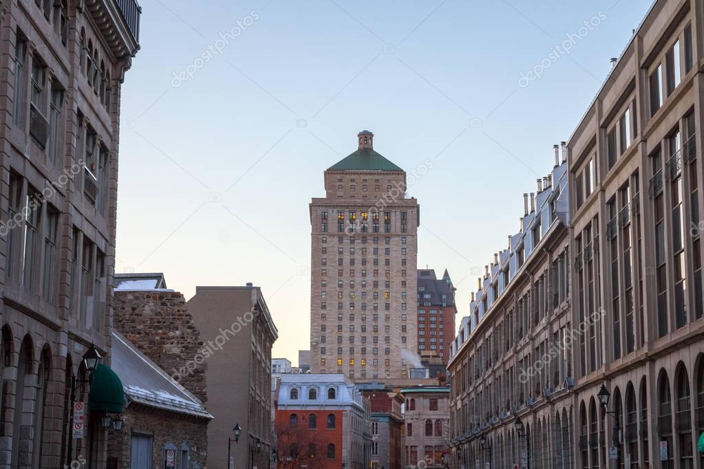 Royal Bank tower seen from a street of Old Montreal at sunset, Quebec, Canada