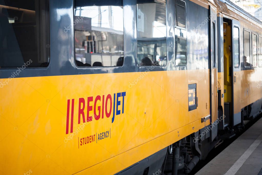 VIENNA, AUSTRIA - NOVEMBER 6, 2019: Regiojet logo on passenger car of train belonging to the company. Part of Student Agency, Regiojet is a Czech private rail & bus transporation private company