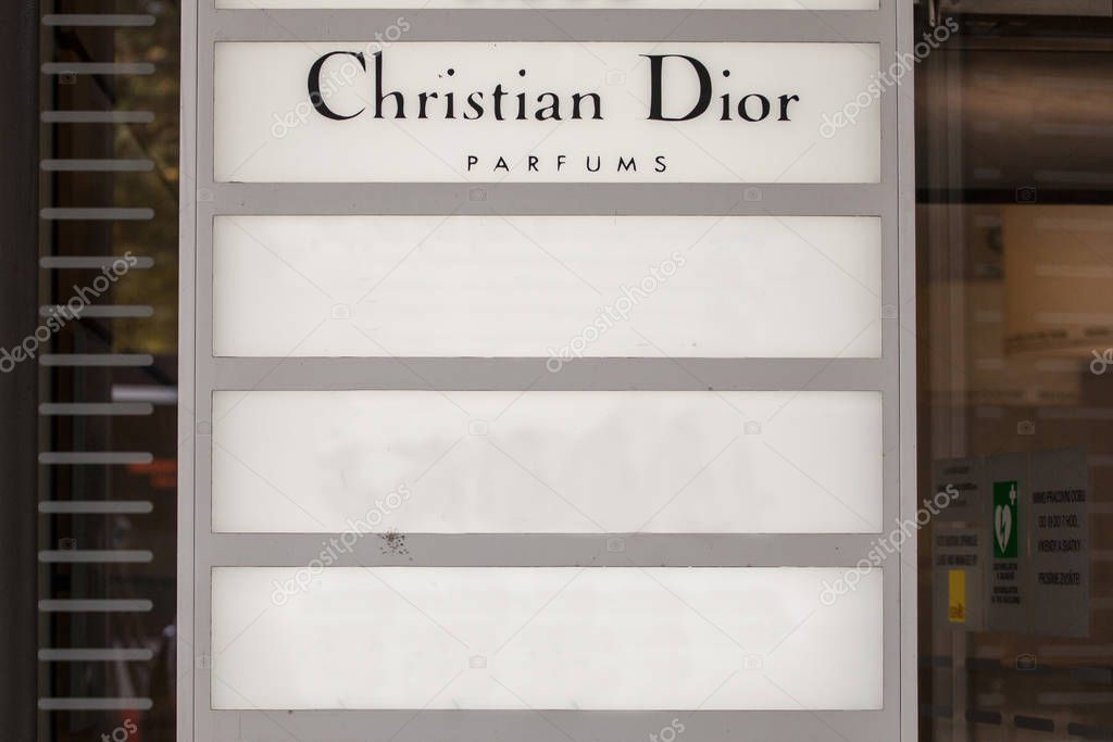PRAGUE, CZECHIA - OCTOBER 31, 2019: Logo of Christian Dior seen on their Prague main office. Christian Dior, or CD, is a French luxury goods company specialized in perfumes and fashion