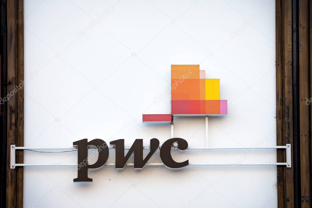 PRAGUE, CZECHIA - NOVEMBER 4, 2019: PWC logo in front of their office for Prague, PWC, or pricewaterhousecoopers, is a British accounting and auditing firm, part of the Big Four Group