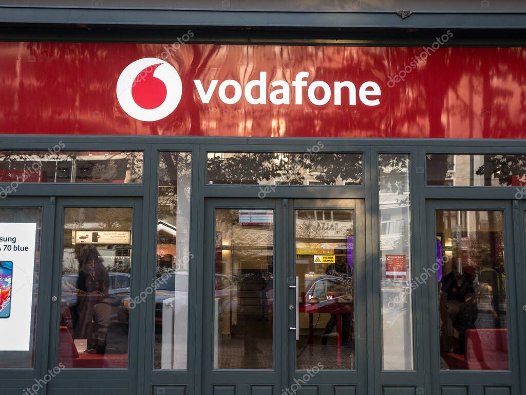 PRAGUE, CZECHIA - OCTOBER 31, 2019:  Vodafone logo on their Prague shop. Vodafone is a british phone carrier and internet service provider, one of main in Czech Republic.