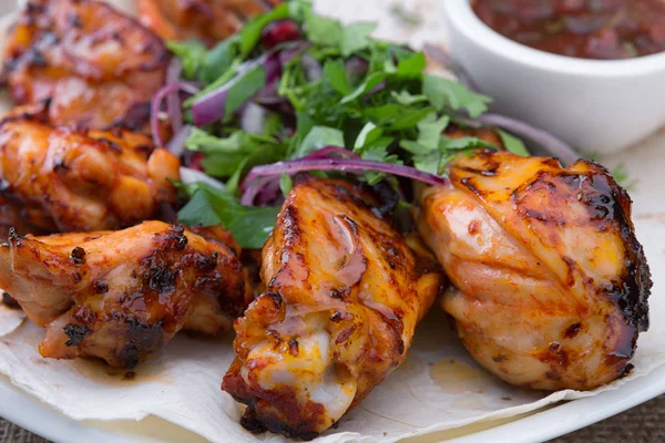 Shish kebab of chicken on a white plate — Stock Photo, Image