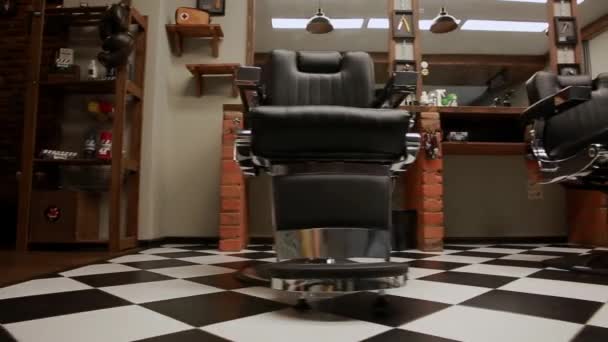 The camera on the Steadicam shows the interior of a Barber shop with a beautiful design. — Stock Video