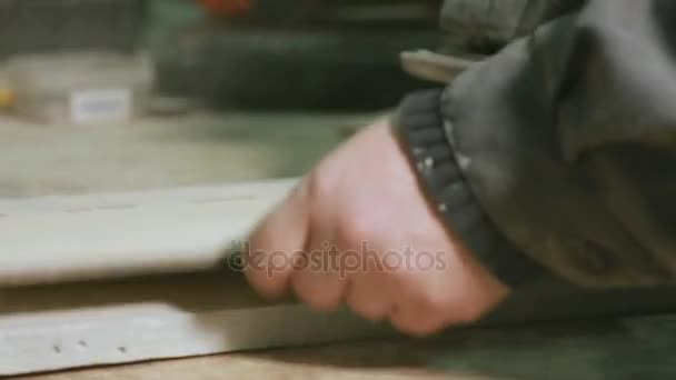 Close-up of male hands a professional grinding machine manufactures the cleaning products. — Stock Video