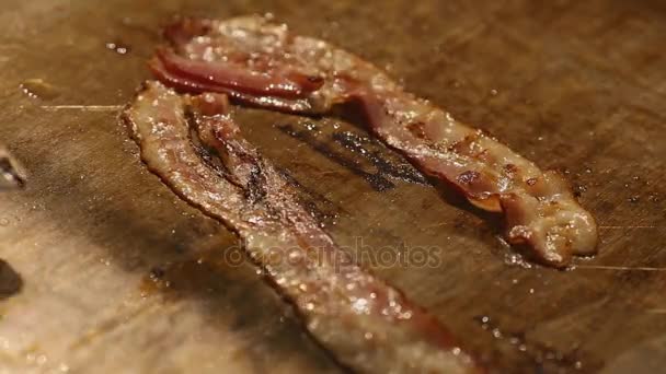 The bacon which is fried in butter. — Stock Video