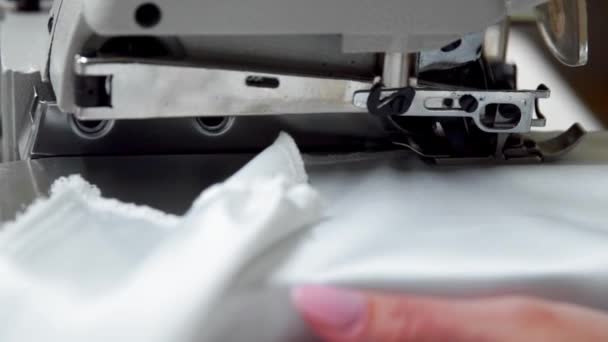 Close up on a sewing machine showing process — Stock Video