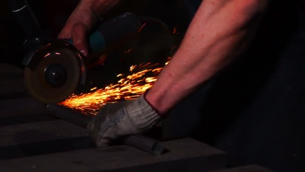 Closeup on electric saw and hands of worker with sparks. man working with grinder, close up on tool, sparks fly, real situation picture. — Stock Video