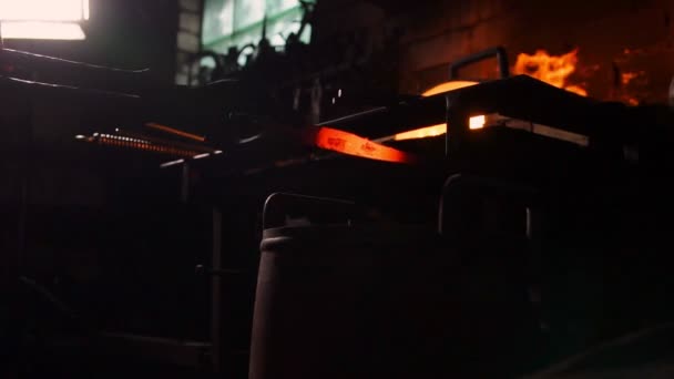 Hardening of the metal by sharp cooling in water. There is steam. The blacksmith tempers a red-hot sword on an old technology. Creation of ancient weapons. Blacksmiths Armory. — Stock Video