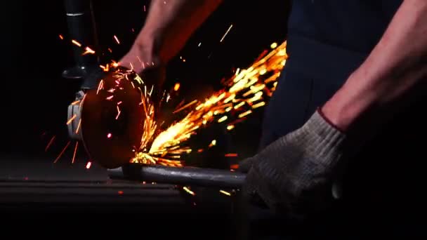 Industrial engineer working on cutting a metal and steel with compound mitre saw with sharp, circular blade — Stock Video