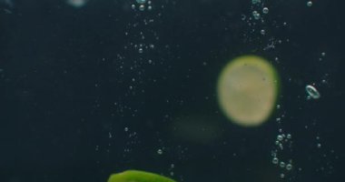 Lime Underwater with air bubbles and in slow motion. Fresh and juicy healthy vegetarian.