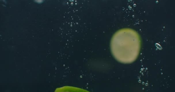 Lime Underwater with air bubbles and in slow motion. Fresh and juicy healthy vegetarian. — Stock Video