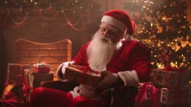 Santa Claus checks gifts before Christmas. The counting of gifts