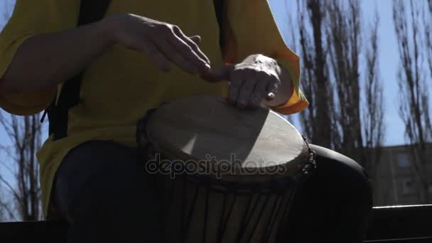 Male drumming on djembe, hands closeup — Stock Video