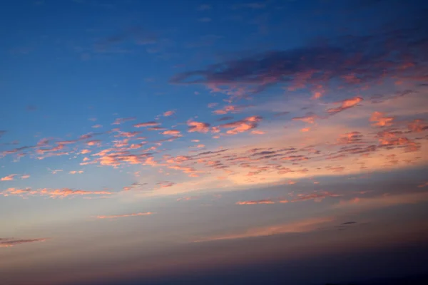 Pattern of white clouds streaming by wind with blue sky