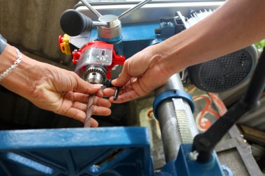 Worker with Drill presses machine for industry clipart