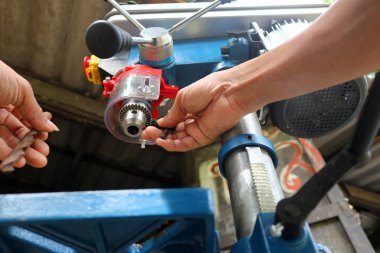 Worker with Drill presses machine for industry clipart